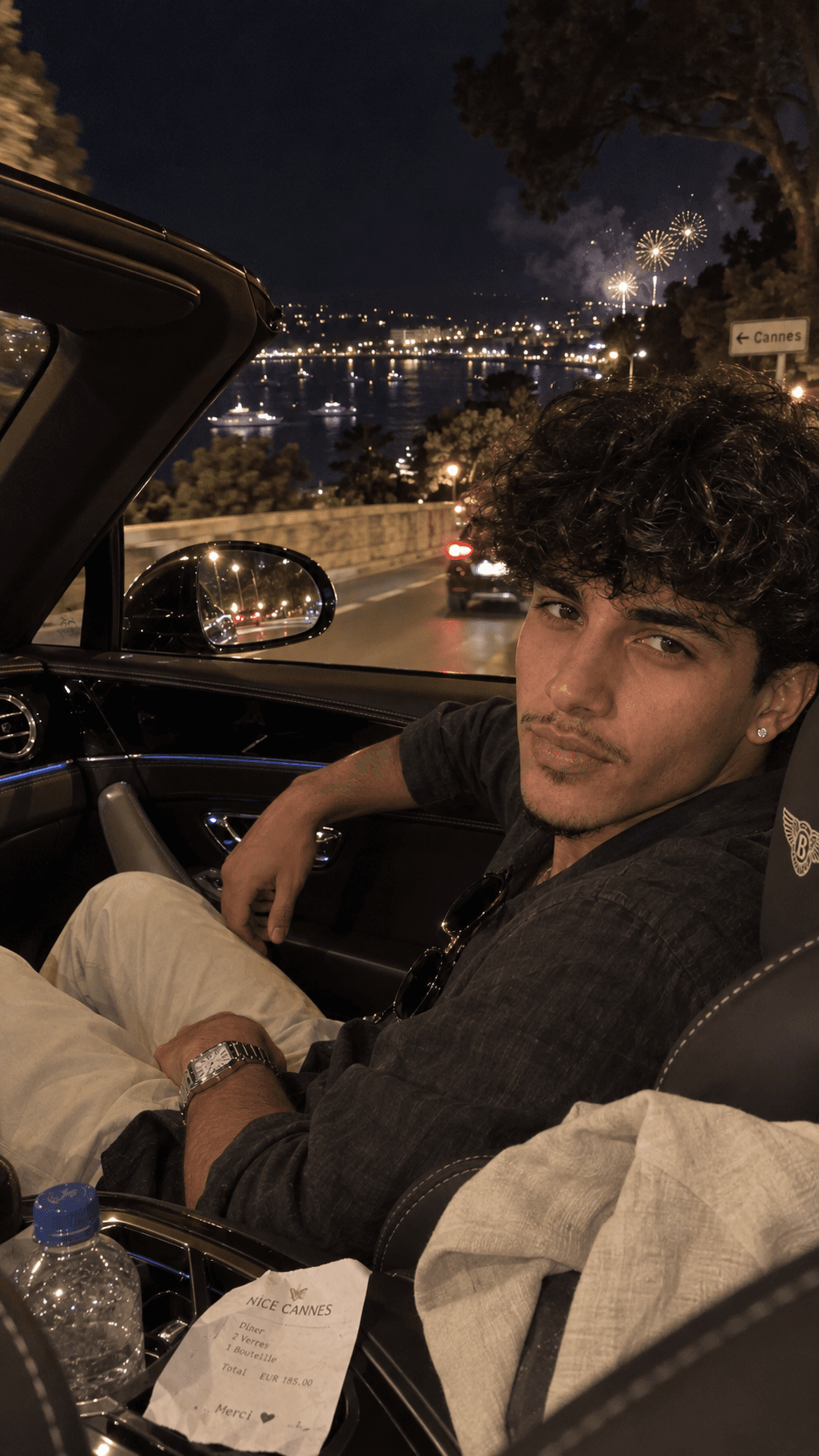 AI-generated nighttime Bentley ride overlooking Riviera fireworks